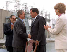 President Bush shakes hands with Tom Ridge