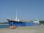 Cargo ship loaded with ADEOS-II bus modules, SeaWinds and other mission modules arrive at Shimama port in Tanegashima on Tuesday, 25 Sep 2001.