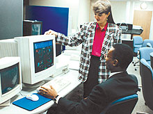 Man and Woman Viewing Computer Screen