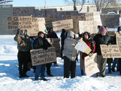 The volunteers held cardboard signs at busy intersections to raise awareness and remind commuters of the problems that homeless individuals and families face every day.