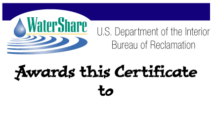 A white, oval shape logo, with the title WaterShare centered in green letters.  There is a blue drop of water and the title, Watershare. To the right in black text is the words U.S. Department of Interior Bureau of Reclamation