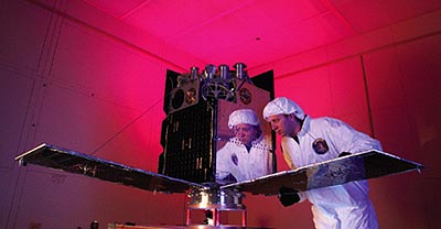 Daniel Seitz inspects Cibola’s solar panels