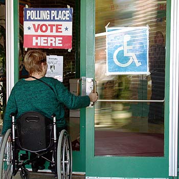 voter using wheelchair enters polling place