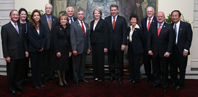 Photo of the U.S. higher education delegation to Brazil and Chile led by Education Secretary Margaret Spellings and Deputy Assistant Secretary of State, Thomas Farrell, with eight U.S. college and university presidents and sponsored by the State Department at the Presidential Palace in Santiago, Chile, August 21.  From left to right: Mark S. Wrighton, Chancellor, Washington University in St. Louis; Robin Gilchrist, Senior Counselor to the Secretary, U.S. Department of Education; Lauren M. Maddox, Assistant Secretary for Communications and Outreach, U.S. Department of Education; Sean O'Keefe, Chancellor, Louisiana State University; Susan Aldridge, President, University of Maryland - University College; Thomas Farrell, Deputy Assistant Secretary of State for Academic Programs; Gregory L. Geoffroy, President, Iowa State University; Margaret Spellings, Secretary of Education; James B.Milliken, President, University of Nebraska; Sarah Martinez Tucker, Under Secretary, U.S. Department of Education; John Hennessy, President, Stanford University; Eduardo J. Pardon, President, Miami Dade College; and Henry T. Yang, Chancellor, University of California, Santa Barbara.