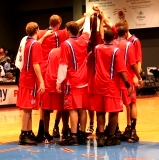 Basketball team huddle (credit: Jeff Kramer)
