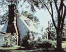 A house surrounded by trees.