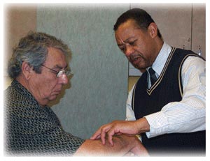 Photo of a doctor examining a patient's arm