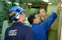 USCG officers inspect vessel