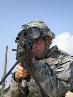 Soldier Holding a Non-Lethal Weapon