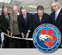 Pictured are the TTIC logo and, at the May 1, 2003, ribbon-cutting ceremony for the Center, Richard Haver, Special Assistant to the Secretary of Defense for Intelligence; J. Cofer Black, Ambassador at Large, Office of Coordination for Counter Terrorism, State Department; FBI Director Robert Mueller; DCI George Tenet; and Gordon England, Department of Homeland Security Deputy Secretary.