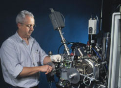 NIST Researcher working on SIMS instrument