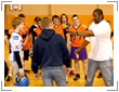 Photo of  NFL players conduct clinic for offensive skills.