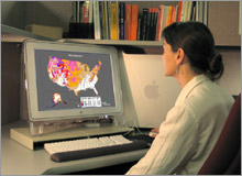 Photo of scientist and electron microscope.