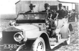Charles Rolls in his Rolls-Royce with Orville and Wilbur Wright and their chauffeur in Shellbeach, England.