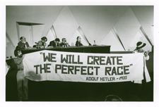 [Protestors and their banner at the March 1977 National Academy of Sciences Forum on Recombinant DNA]. [7-9 March 1977].