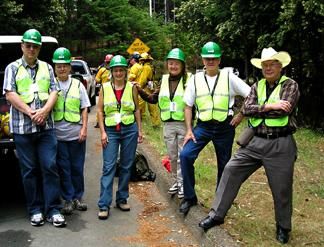 CERT volunteers on-scene with fire crews in the background.