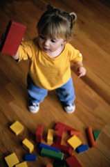 Image of a child playing with blocks