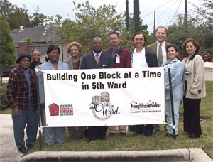 Among those saluting the Sears American Dream Campaign are Kathy Flanagan Payton (third from left), Fifth Ward president and CEO; Harvey Clemons Jr. (fifth from left), Fifth Ward board chair; Tony Davis (fourth from right), Sears district general manager; and Gary Wolfe (third from right), director, NeighborWorks® America's Rocky Mountain District.