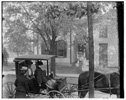  Katharine Wright, Harriet Silliman, and Agnes Osborne in horse-drawn carriage across from Wright home, 7 Hawthorn Street, Dayton, Ohio
