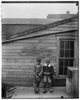  Clarence 'Grandpa' Liv and Alonzo 'Teddy' Tucker behind the Wright Cycle Company.
