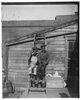  Clarence 'Grandpa' Liv and Alonzo 'Teddy' Tucker behind the Wright Cycle Company. 

