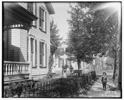  Daniel Henderson, neighbor, in front of Wright home at 7 Hawthorn Street, Dayton, Ohio