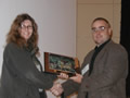 Los Alamos’ Don Brown accepts the appreciation plaque from Claudia Rawn