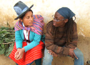 Volunteer Angela Jones chats with her host sister in Peru.