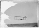  Wilbur gliding in level flight, single rear rudder clearly visible; Kitty Hawk, North Carolina 
