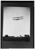  Rear view of flight 46, Orville shown flying at a high altitude over Huffman Prairie, Dayton, Ohio. 

