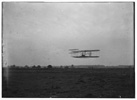  Flight 23: front view of the machine in flight to the right, Orville at the controls, making two complete circles of the field at Huffman Prairie in 2 minutes and 45 seconds; Dayton, Ohio 
