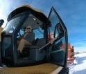 Traverse leader John Wright sits in a Cat Challenger 95 tractor.