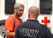 Joshua Norman talks to a New York City firefighter about relief efforts. Firefighters came to Mississippi to return the favor for support following 9/11.