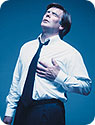 A man holding his chest in pain.