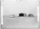  1903 machine and large camp building where it was housed, and smaller building used as a workshop and living quarters at Kill Devil Hills. 

