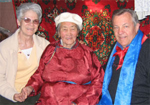 Director and Mrs.Tschetter with Mongolian host inside traditional ger, a type of yurt housing used in Mongolia.