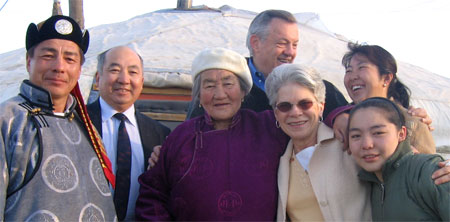 Director and Mrs. Tschetter with a Mongolian host family outside of their traditional ger.