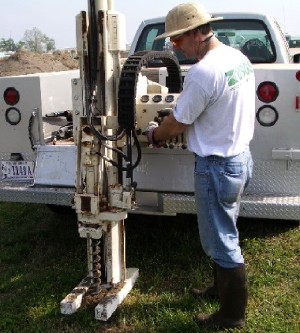 USGS scientist using a direct-push rig to collect sediment samples for analysis at Laurel Bay, South Carolina