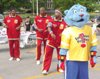 Photo of the Harlem Globetrotters and the Power Panther mascot