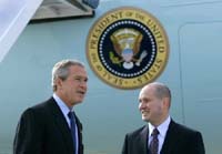 President George W. Bush met Eric Rasmussen upon arrival in Detroit, Michigan, on Friday, July 23, 2004.  Rasmussen is an active volunteer with the Tax Assistance Program at the Volunteer Accounting Service Team of Michigan (VAST-MI), providing low-income families with free tax advice.  Rasmussen is the 300th volunteer the President has greeted since March 2002.