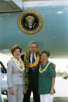 President George W. Bush met Hilma Chang upon arrival in Honolulu, Hawaii, on Thursday, October 23, 2003.  For more than 10 years, Chang has been an active volunteer with the National Park Service volunteering each week at the USS Arizona Memorial.  