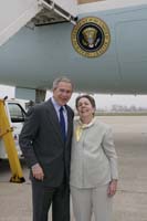 President George W. Bush presented the President’s Volunteer Service Award to Daisy VanDenburgh upon arrival at the airport in New Orleans, Louisiana, on Thursday, January 12, 2006. VanDenburgh is a reading volunteer with the Tulane Community Outreach Literacy Program. To thank them for making a difference in the lives of others, President Bush has met with more than 450 individuals around the country, like VanDenburgh, since March 2002.