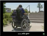 photo of a man using a power wheelchair
