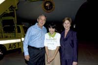 President George W. Bush met Malee Austin upon arrival in Orlando, Florida, on Saturday, October 30, 2004. Austin is an active volunteer with Hands On Orlando, a coordinating agency for volunteer service projects in the Central Florida region.