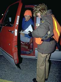 Image of FWS officer checking a hunting license