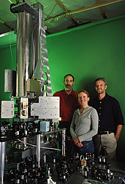 Three scientists with the NIST F1 atomic clock