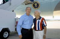 President George W. Bush met Elwood Thalheimer upon arrival in Jacksonville, Florida, on Saturday, October 23, 2004.  Thalheimer, 92, is an active volunteer with a number of nonprofit organizations through the Retired and Senior Volunteer Program (RSVP).