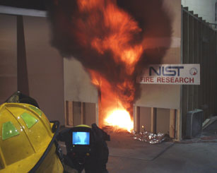 researchers using thermal imager to view fire