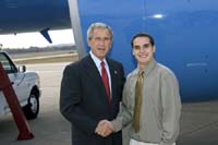 President George W. Bush met Mick Jay Krueger upon arrival in Eau Claire, Wisconsin, on Wednesday, October 20, 2004.  Krueger, a senior at the University of Wisconsin - Eau Claire, is an active volunteer with First Book, a non-profit organization that helps low income children get one new book every month during the school year.
