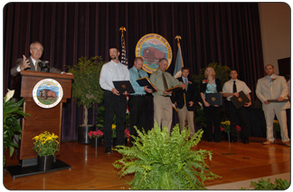 Secretary Kempthorne presents the Department's Valor Award to Bureau of Land Management firefighters Scott W. Brandt,Michael D. Hendrickson, Lester M. McDonald, Michael Sperry, Michael C. McMaster, Scott Meneely, Andrew Rishavy, Andrea Robinson, Andrew Snyder, and Steven Spellberg (awardees listed in alphabetical order).